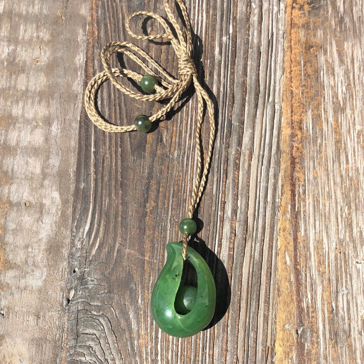 Jade Pendant with jade bead inside, 1.25"