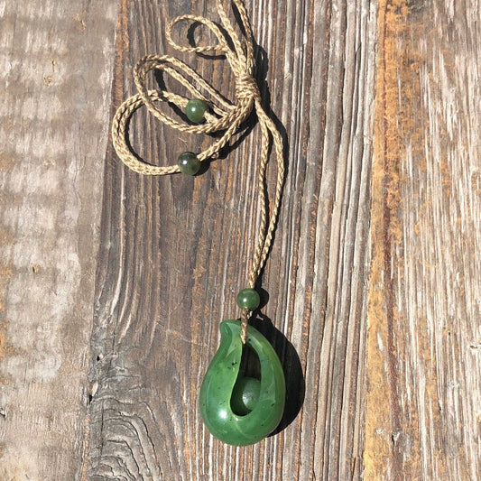 Jade Pendant with jade bead inside, 1.25"