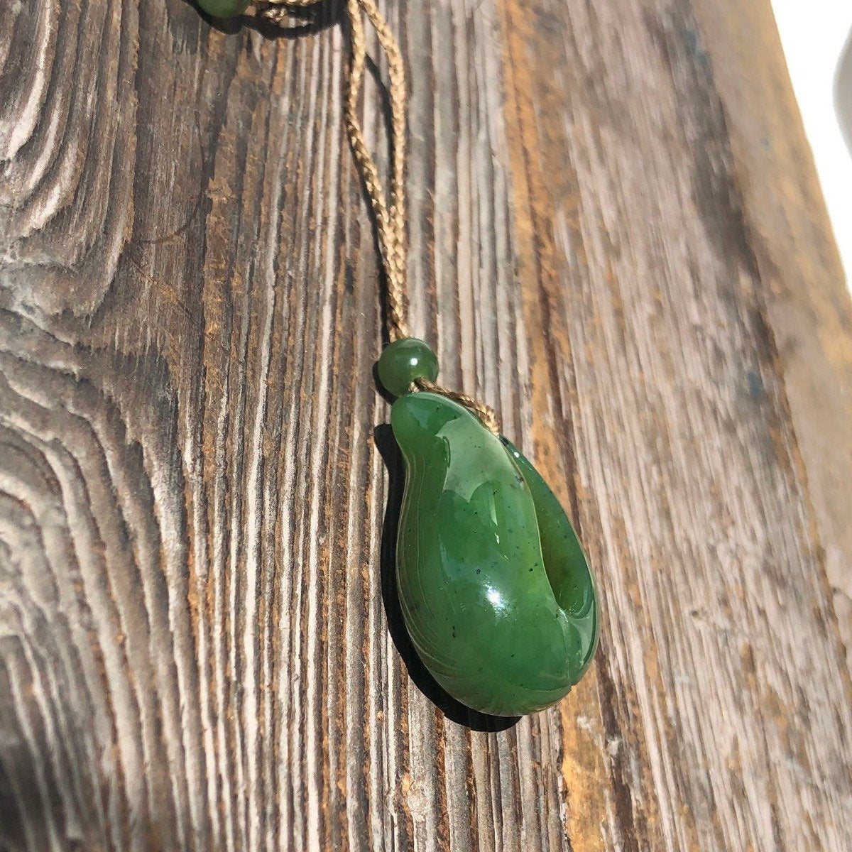 Jade Pendant with jade bead inside, 1.25"